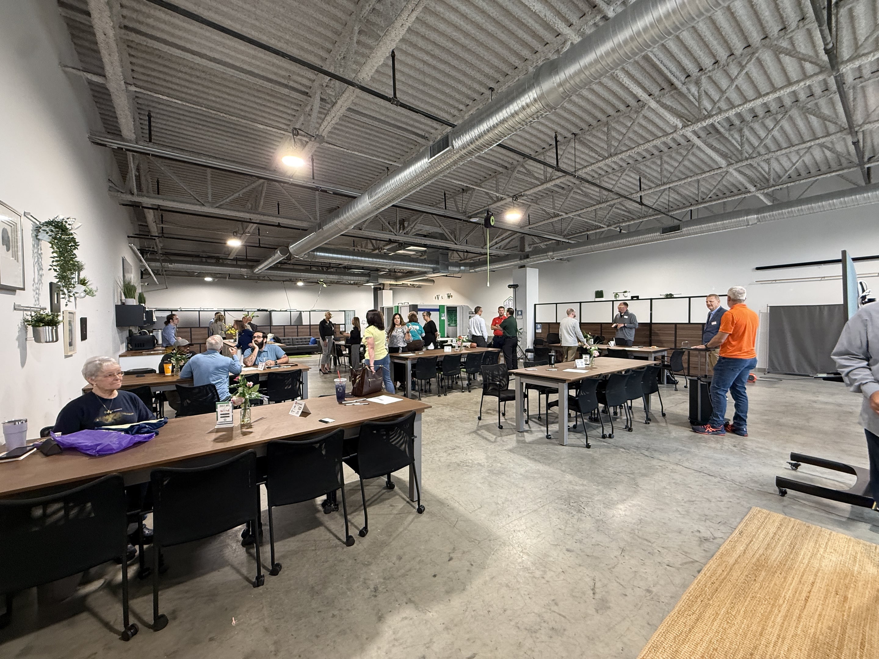 Image of people talking and networking in Level Two's community studio.